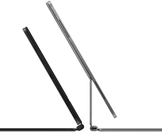 2 iPad Pro devices attached to Magic Keyboard, side exterior, thin profile, space black colour with speakers and USB-C port, tilted half open, silver colour, open, tilted back showing the keyboard’s floating cantilever design, speakers and microphone