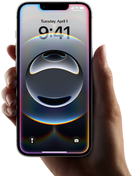 A hand holds iPhone 16e, light, colourful glow along edge of all-screen display
