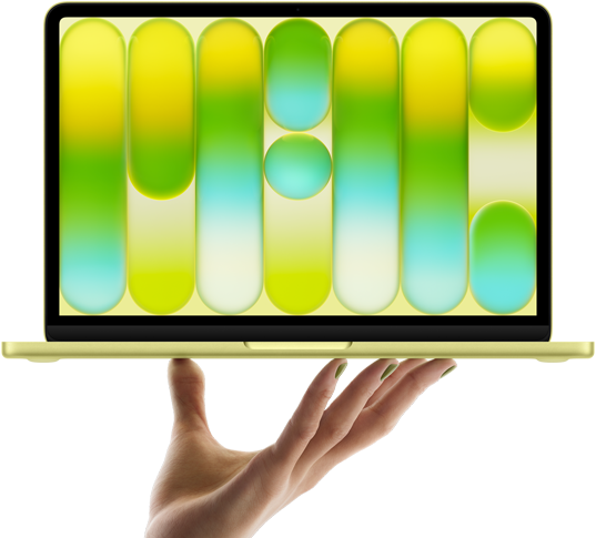 MacBook Neo in citrus colour, balanced on fingertips of open hand, screen displaying colourful abstract pattern