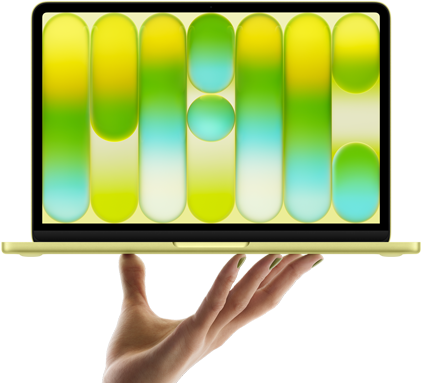 MacBook Neo in citrus colour, balanced on fingertips of open hand, screen displaying colourful abstract pattern